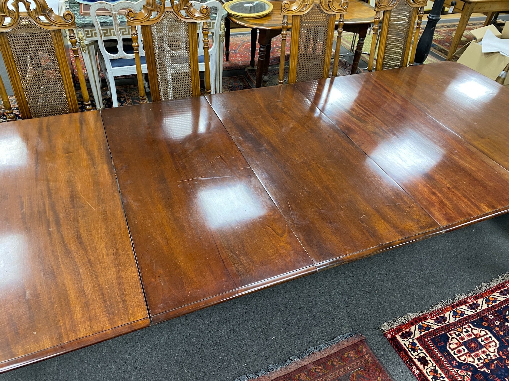 A Victorian mahogany extending dining table, 320cms extended, three spare leaves, depth 130cms, height 73cms.